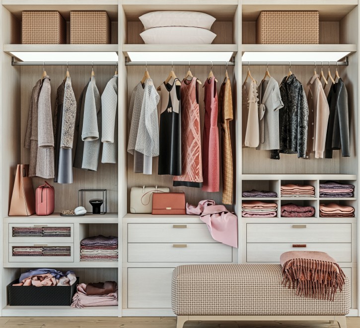 Discover a stylish and organized walk-in closet featuring modern furniture, hanging clothes, and storage solutions for a fashionable wardrobe.