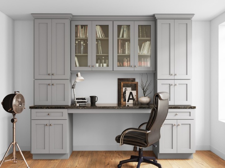 Elegant home office featuring gray cabinets, a spacious desk, and comfortable chair. Ideal for productivity and style.